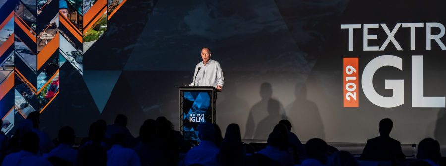 Global Leadership meeting - man presenting onstage