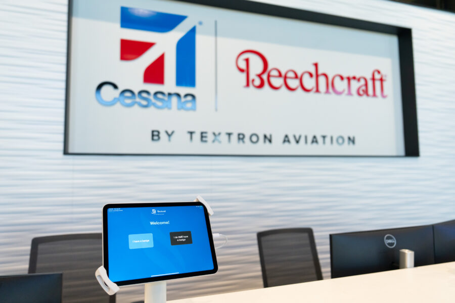 CLC check in area with Cessna / Beechcraft logo behind desk